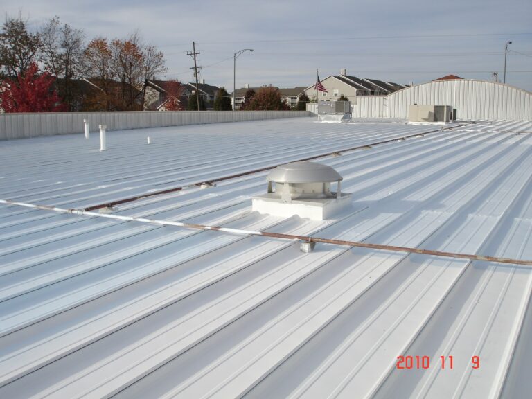 Flat metal roof with elastomeric coating.