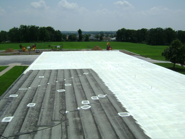 Roof restoration with elastomeric coating.